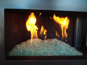 corner fireplace with glass rocks on fire corner fireplace with glass rocks on fire