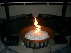 patio fire bowl with burning glass 