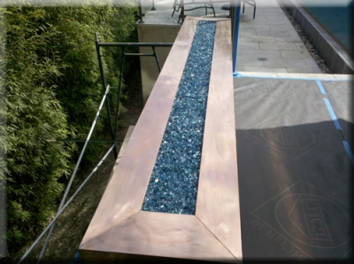 Copper top outdoor fire pit with fireglass