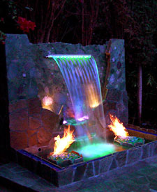 waterfall with colored lights and fire 
