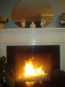 custom fireplace with fire burning glass stones
